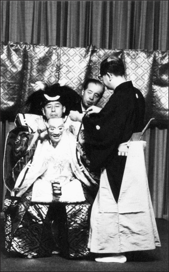 Noh performer with mask