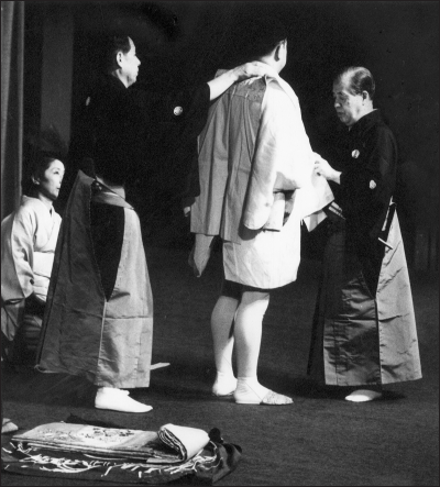 Noh performer getting dressed